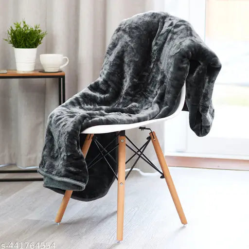 Solid color king size cotton blanket Kambal, ideal for heavy winter use, on a display stand