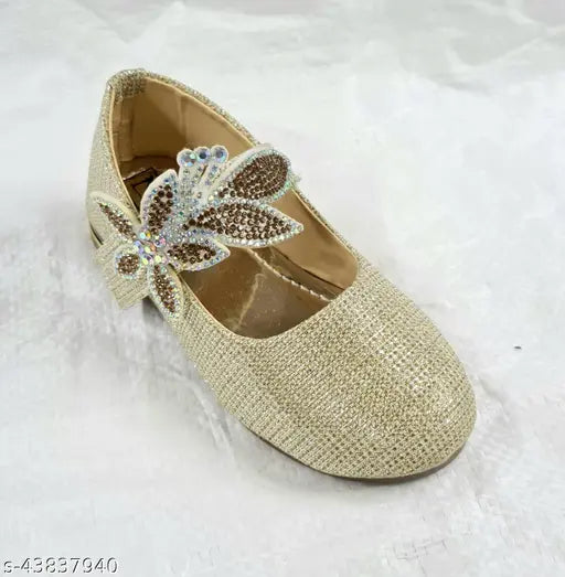 Stylish gold juttis with butterfly embellishments
