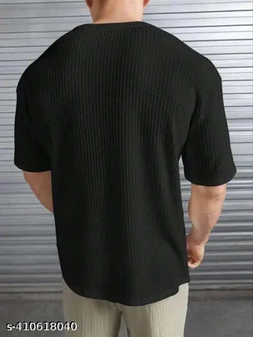Men's cotton blend oversized dropshoulder T-shirt in solid round neck, featuring short sleeves and relaxed fit for unrestricted movement. Available in various colors and designs, perfect for casual wardrobe essentials