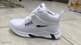 White sneakers with 'NIKE' logo, suitable for kids