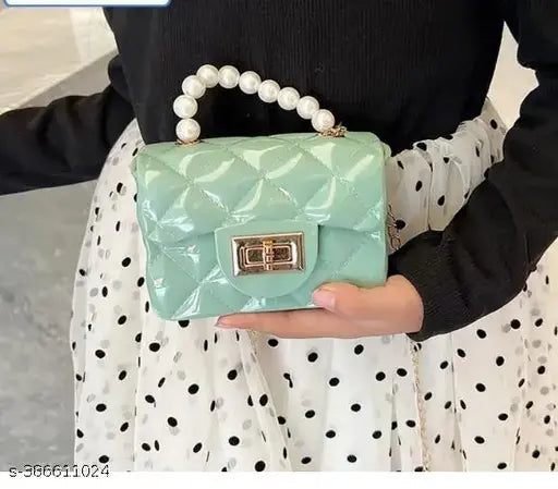 Teal crocodile skin purse with pearls and a lock closure