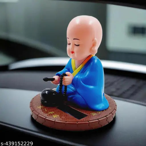 Blue solar-powered moving Gautam Buddha statue with round base, eco-friendly religious idol for home or office decor