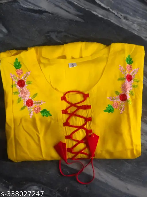 Yellow rayon three-quarter sleeve embellished kurti, single pattern, Indian hand embroidery on display