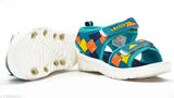 The image depicts a pair of limited edition Lecosta sea green sandals, designed for boys aged 5 to 10 years. These sandals feature a colorful design and are crafted with comfort in mind. They are ideal footwear for warm weather or casual outings