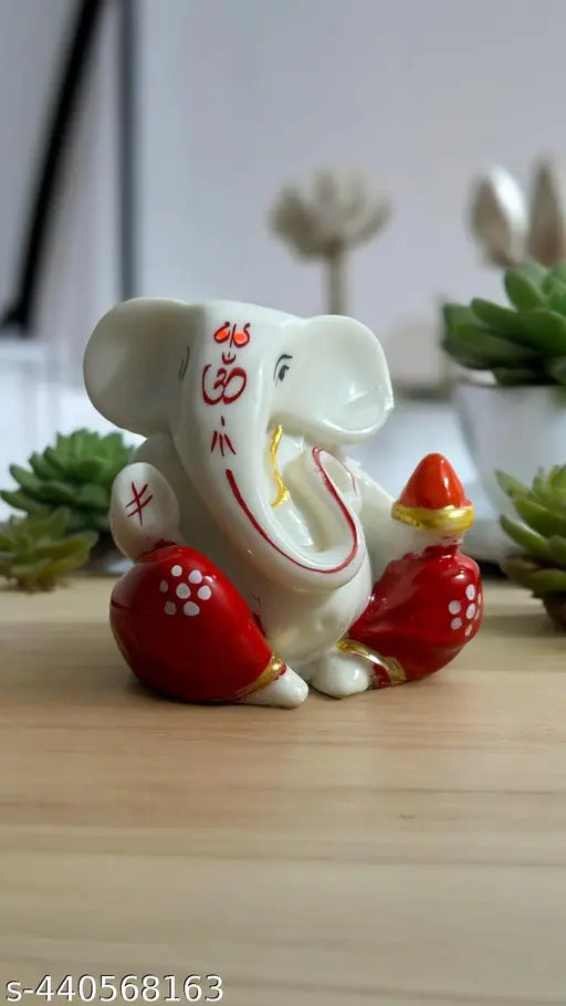 Red compact Ganesha idol, ideal for car dashboards, desks, or offices - symbolic representation of Lord Ganesh for Diwali decoration