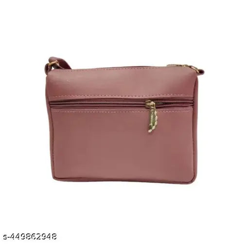 Women's pink leather crossbody sling bag with zip closure