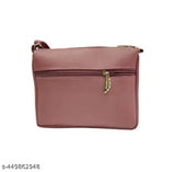 Women's pink leather crossbody sling bag with zip closure