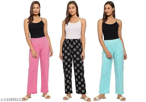 The image shows a set of three women's lounge pants in multicolored prints, presented against a white background. These pyjamas are made from cotton fabric and have an elastic waistband for a comfortable fit. The pants feature short sleeves and are part of a combo pack with the number 3 visible at the top right corner