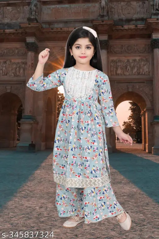Modern girls cotton blend kurta & palazzo set, printed A-line sharara with three-quarter sleeves. Sizes: 4-5Y, 5-6Y, 6-7Y, 7-8Y, 8-9Y, 9-10Y, 10-11Y, 11-12Y. Made in India