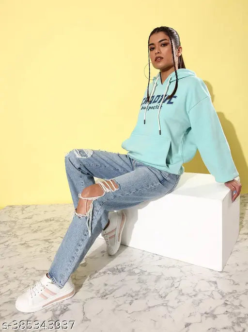 Turquoise blue oversized hoodie with typographic print on fleece, long sleeves and large fit, model wears XL size