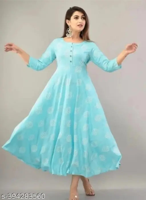 Sky blue printed cotton kurti with three-quarter sleeves, vibrant pattern on display, available in multiple sizes from XS to 4XL