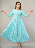 Sky blue printed cotton kurti with three-quarter sleeves, vibrant pattern on display, available in multiple sizes from XS to 4XL