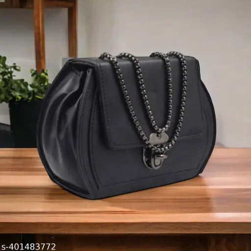 Black sling bag with a chain strap, suitable for women