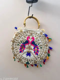 White handbag with canvas body and sling strap, featuring embroidered designs in white and pink on a cotton base