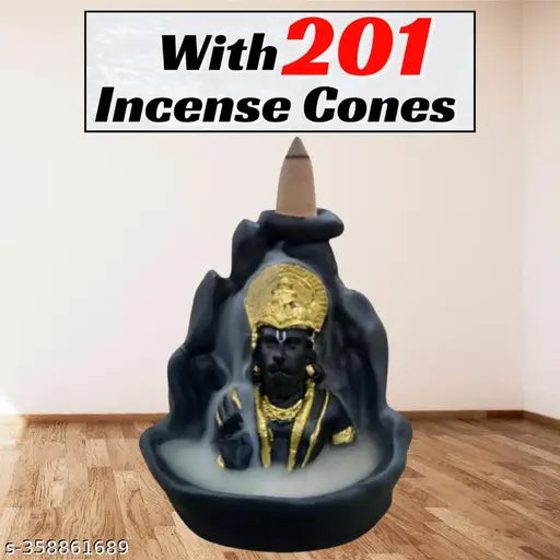 A decorative item, possibly a container for incense sticks or backflow cones, with an inscription of "Lord Hanuman" and shaped like a person submerged in water. The design resembles a fountain scene