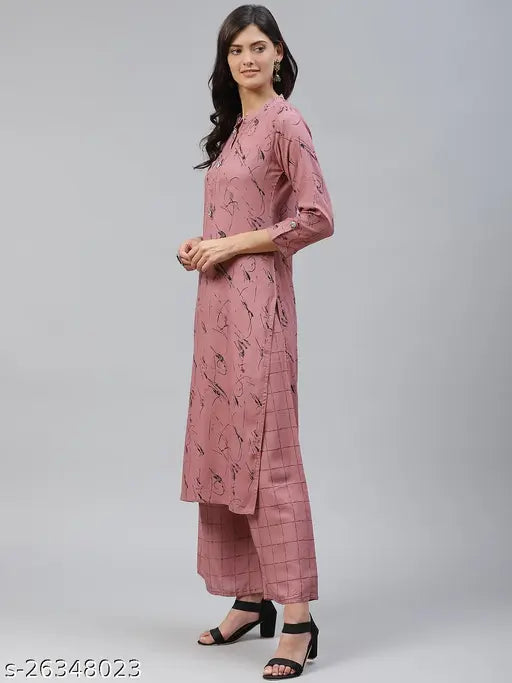 Pink rayon kurta palazzo set, self-designed net print on straight fit calf length palazzos and mandarin collar kurta, perfect for women's regular wear, from Highlight Fashion Export, India