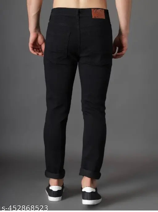 Black slim fit jeans with a noticeable waist band pocket detail, as seen on the front of the model's pants in the image