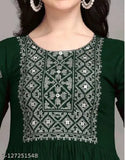 A woman in a long-sleeve green embroidered kurti
