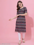 A woman modeling a long-sleeve, knee-length dress with a floral pattern and aqua blue color. The dress features a V-neck, short sleeves, and a round neckline. She is standing against a pink background
