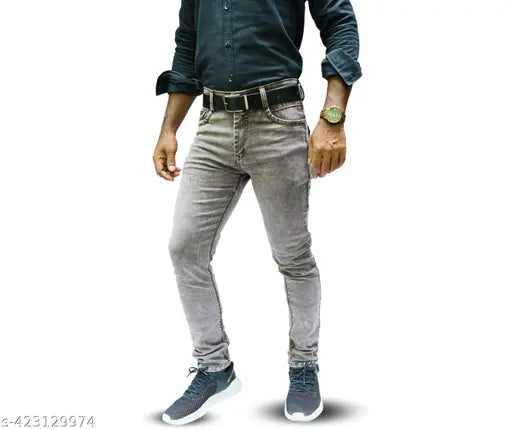 Black jeans with rolled-up cuffs and a black belt