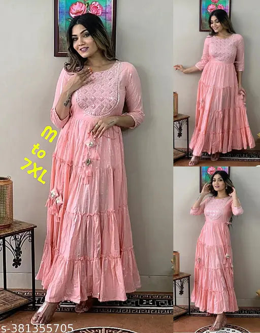 Long, pastel pink embroidered cotton kameez with full flare and tassel details for women