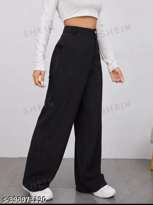 Girl wearing black high-waisted trousers