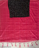 Black, sequined fabric with pink trim on the border