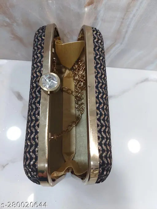 Fashionable women's clutch, gold tone, with a wrist strap and a keychain