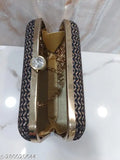 Fashionable women's clutch, gold tone, with a wrist strap and a keychain