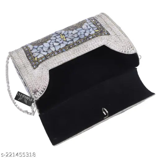 Silver metal clutch with a sling strap, ideal for parties and events