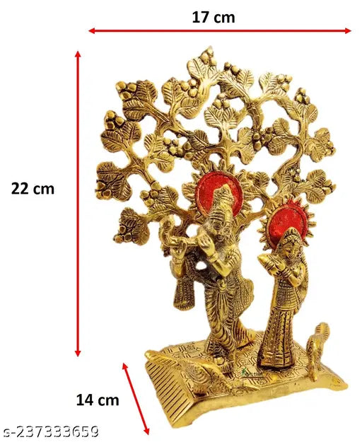 Metal Radha Krishna figurine from Bagla Creations, 22cm tall, set under a large tree in India