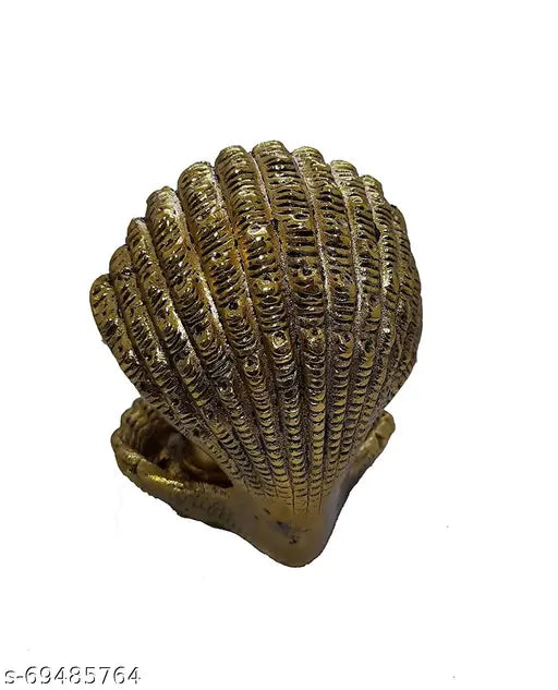 Gold metal shell-shaped ornate decoration, possibly for worship or festive display