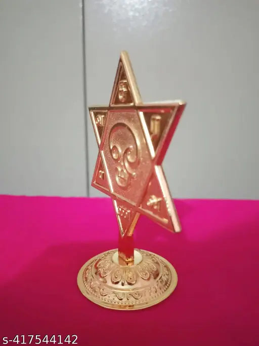 Golden Metal Murugan SARAVANA Star Shape Vel - Elevate your sacred space with protective symbol, perfect for gifting, office, shop, temple, or car dashboard. Exquisitely crafted from durable metal with a radiant golden finish. 3.5 inches tall, ideal for pooja rooms and meditation spaces. Country of Origin: India