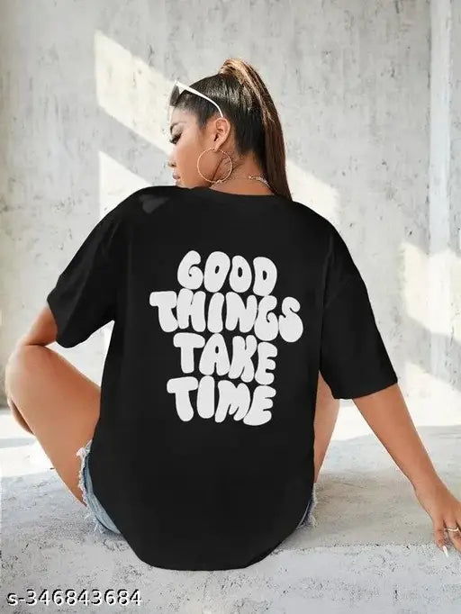 A black cotton round neck women's half-sleeved oversized printed t-shirt with a motivational message
