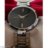 Silver-toned analog watch with black face, date window, and minimalist design for girls and women