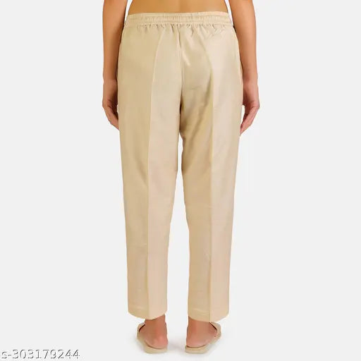 Fawn-colored poly blend women's kurti pant with both side pockets, full elastic, and high stitching quality. Size options: 36, M (28in/37in/41in), L (30in/37in/43in), XL (32in/38in/45in), XXL (34in/39in/48in). Indian branded measurement