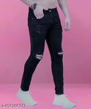 Stylish black distressed jeans with a knee cut, casual fashion