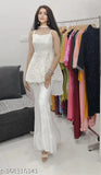 Stylish white sleeveless top with ruffled hem, part of a Sharara top set