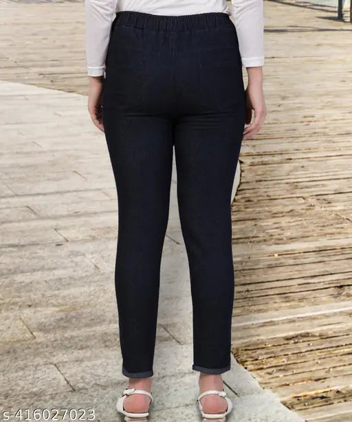 Black stretchable premium denim high-waist jogger jeans for women, featuring an elastic waist and ankle cuffs