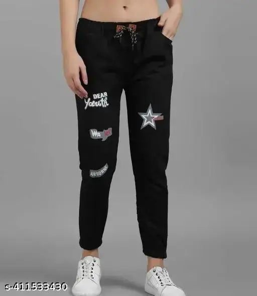 Women's black denim jeans with printed net detail, size 24/waist 24in, length 34in (Indian origin)