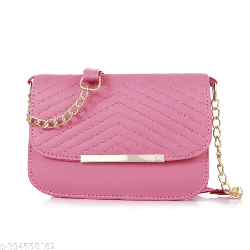 Pink faux leather crossbody purse with a chain strap