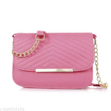 Pink faux leather crossbody purse with a chain strap