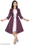 A girl in a purple and white patterned dress, with a black belt at the waist