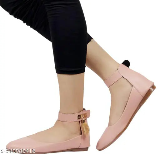 Stylish peach synthetic leather bellies shoes for women under 300, featuring velcro fastening and black insole. Perfect for parties, casual wear, or festive occasions. Versatile with leggings, jeans, jeggings, or palazzo. Comfortable half-inch PVC sole and back belt detail. Indian origin