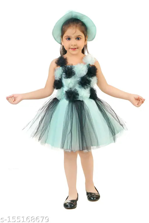 Blue net frock with ruffled trim and black cap
