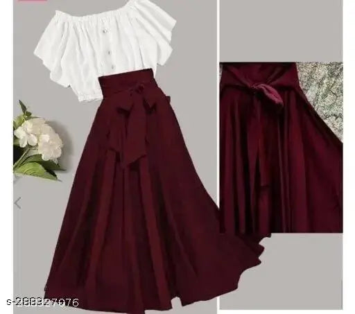This image features two different skirts, both with ruffled or puff designs at the waistband. The skirt on the left is a darker red or burgundy color and appears to be made of a solid fabric without any additional patterns or textures. The skirt on the right has a darker background with what seems to be a floral pattern, showcasing its lace overlay effect, which adds a layer of ruffled detailing at the waistband. Both skirts have a fitted bodice and flow out from the waist area