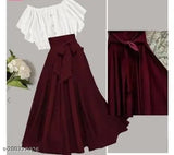 This image features two different skirts, both with ruffled or puff designs at the waistband. The skirt on the left is a darker red or burgundy color and appears to be made of a solid fabric without any additional patterns or textures. The skirt on the right has a darker background with what seems to be a floral pattern, showcasing its lace overlay effect, which adds a layer of ruffled detailing at the waistband. Both skirts have a fitted bodice and flow out from the waist area