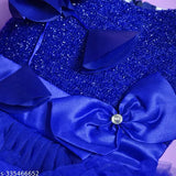 Blue satin party dress with no sleeves, adorned with a bow on the front