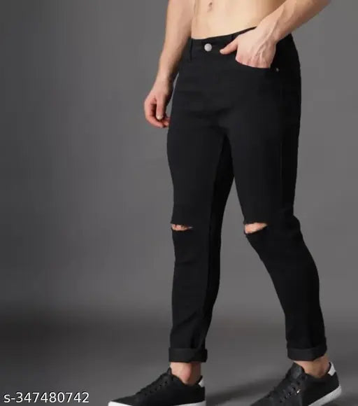 Black denim flaying men's knee-slit jeans on hanger, solid style, sizes 28, 30, or 32 (India origin)