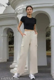 Brown high-waisted trousers with a dark top